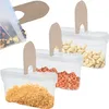 Three clear plastic storage containers with tan lids, each filled with different food items: mixed nuts, garlic cloves, and peanuts. Produktbild-Vorschau