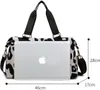 A leopard print duffel bag with a laptop placed on top, showing dimensions. Produktbild-Vorschau