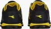The back view of two black and yellow Diadora athletic shoes are shown against a white background. Náhľad obrázku produktu