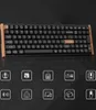 A black mechanical keyboard with wooden accents is displayed against a dark background, with a row of icons below it. Voir les images du produit