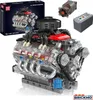 A detailed model of a V8 engine, along with its packaging and some additional components, displayed against a white background. Náhled obrázku produktu