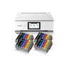 A white Canon printer with stacks of ink cartridges in front of it. Produktbild-Vorschau