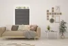 A living room scene with a sofa, window blinds, and decorative wall art. Produktbild-Vorschau