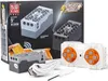 The image shows the packaging and components of a Mould King powered module set, including a remote control and charging cable. Produktbild-Vorschau
