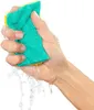 A hand squeezing a sponge with water running out. Anteprima dell’immagine prodotto