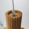 Close-up of the top of a wooden pendant light. Voir les images du produit