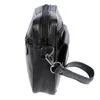 A black leather wrist bag is shown from a side angle against a white background. Náhled obrázku produktu