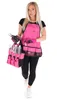 A woman is holding a gardening tool bag and tools, wearing a pink gardening apron. Podgląd zdjęcia produktu