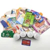 A pile of various food product packaging and some metal cans, along with a credit card. Produktbild-Vorschau