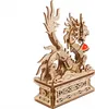 A wooden model of a dragon on a decorative base. Anteprima dell’immagine prodotto