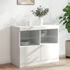 A white sideboard with various compartments and shelves, holding plates, cups, and decorative flowers. Voir les images du produit