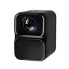 A black projector with a lens and speaker grille, shown against a white background. Voir les images du produit