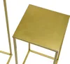 A close-up view of a gold metal plant stand. Náhled obrázku produktu