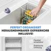 A close-up view of the interior of a white freezer, showing a removable basket with frozen food items and text overlays highlighting features. Produktbild-Vorschau