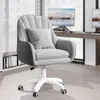 A gray velvet office chair with a white base and wheels is shown in a home office setting. Produktbild-Vorschau