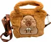 A plush capybara-shaped handbag with a strap. Produktbild-Vorschau