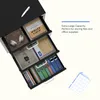 A black filing cabinet with open drawers, showcasing office supplies and accessories. Anteprima dell’immagine prodotto