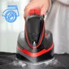 A person ironing clothes with a cordless steam iron. Voir les images du produit