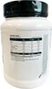 A white plastic tub of protein powder with a black lid, showing the nutrition facts label. Produktbild-Vorschau
