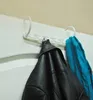 A multi-hanger organizer is used to hang a black leather jacket and a blue scarf on a white door. Podgląd zdjęcia produktu