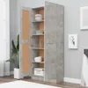 A tall, open cabinet with a concrete gray finish, displaying shelves with dishes, bowls, and a box. A large potted plant is visible to the left. Náhled obrázku produktu