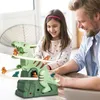 A father and daughter are playing with a dinosaur toy. Náhled obrázku produktu