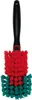 A cleaning brush with a black handle and red and teal bristles. Produktbild-Vorschau