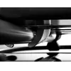 A close-up, abstract view of metal components, possibly from a car roof box or similar equipment. Produktbild-Vorschau