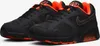 A pair of black and orange Nike Air Max 180 sneakers are shown from a slightly elevated side angle against a white background. Náhľad obrázku produktu