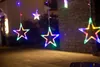 Hanging star-shaped lights with colorful LEDs illuminate an outdoor area at night. Náhled obrázku produktu