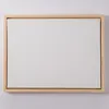 A blank canvas in a wooden frame, presented against a white wall. Náhľad obrázku produktu
