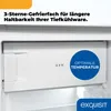 Close-up of the interior of a refrigerator, showing a freezer compartment with a star rating and a temperature indicator. Produktbild-Vorschau
