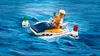 A LEGO minifigure riding a jet ski in the ocean, with buoys. Produktbild-Vorschau