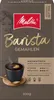 A bag of Melitta Barista ground coffee with an illustration of a woman and a cup of coffee. Produktbild-Vorschau