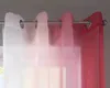 Close-up of sheer curtains with a gradient color effect hanging from a curtain rod. Produktbild-Vorschau