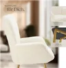 A close-up of a cream-colored armchair with gold legs, with inset images showing fabric detail and the leg structure. Text overlays describe comfort and material. Náhled obrázku produktu