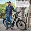 A man in denim clothing stands next to a black electric bicycle on a city street. Produktbild-Vorschau
