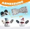 A marketing image showing a pair of black hand warmers, a grey hand warmer muff, and two snowmen with different colored hand warmers as arms, set against a snowy, blue sky background with snowflakes. Produktbild-Vorschau