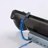 A close-up shot of a gaming console connected to a USB-C hub. Produktbild-Vorschau