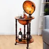 A wooden globe bar with bottles of wine and glasses on display. Anteprima dell’immagine prodotto