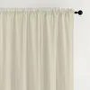 A close-up view of a beige curtain hanging from a curtain rod. Produktbild-Vorschau