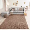 A living room scene with a sofa, rug, and other furniture. Produktbild-Vorschau