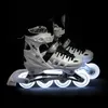 A pair of inline skates with LED lights on the wheels, set against a black background. Produktbild-Vorschau