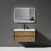 A modern bathroom vanity with a sink and mirror mounted on a gray wall. Produktbild-Vorschau