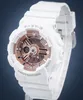 A white Casio Baby-G watch with rose gold accents is shown against a dark blue and gray background. Anteprima dell’immagine prodotto