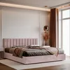 A modern bedroom with a pink upholstered bed. Anteprima dell’immagine prodotto