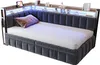 A modern upholstered daybed with integrated LED lighting and storage shelves. Produktbild-Vorschau