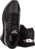 A pair of black Reebok sneakers with pink accents, shown from a slightly angled front view. Voir les images du produit