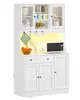 A white kitchen cabinet with glass doors, shelves, drawers, and a microwave. Voir les images du produit