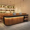 A modern reception desk with computers and decorative plants. Produktbild-Vorschau